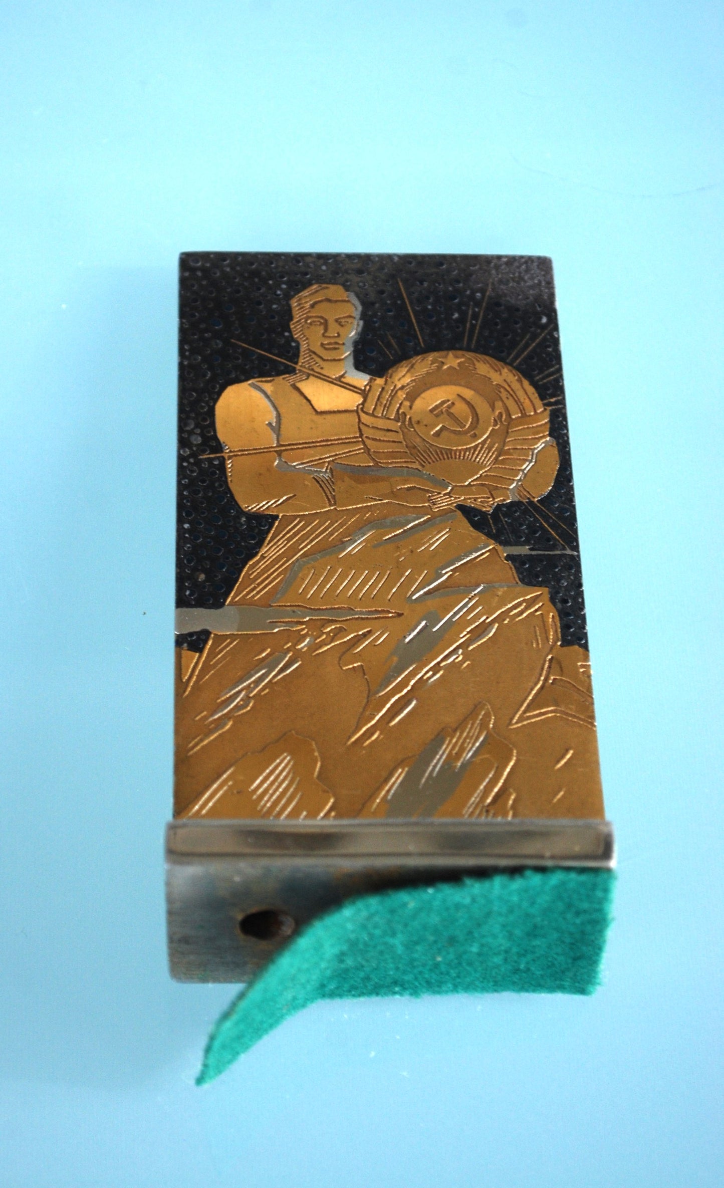 CCCP coat of arms in the hands of a worker *