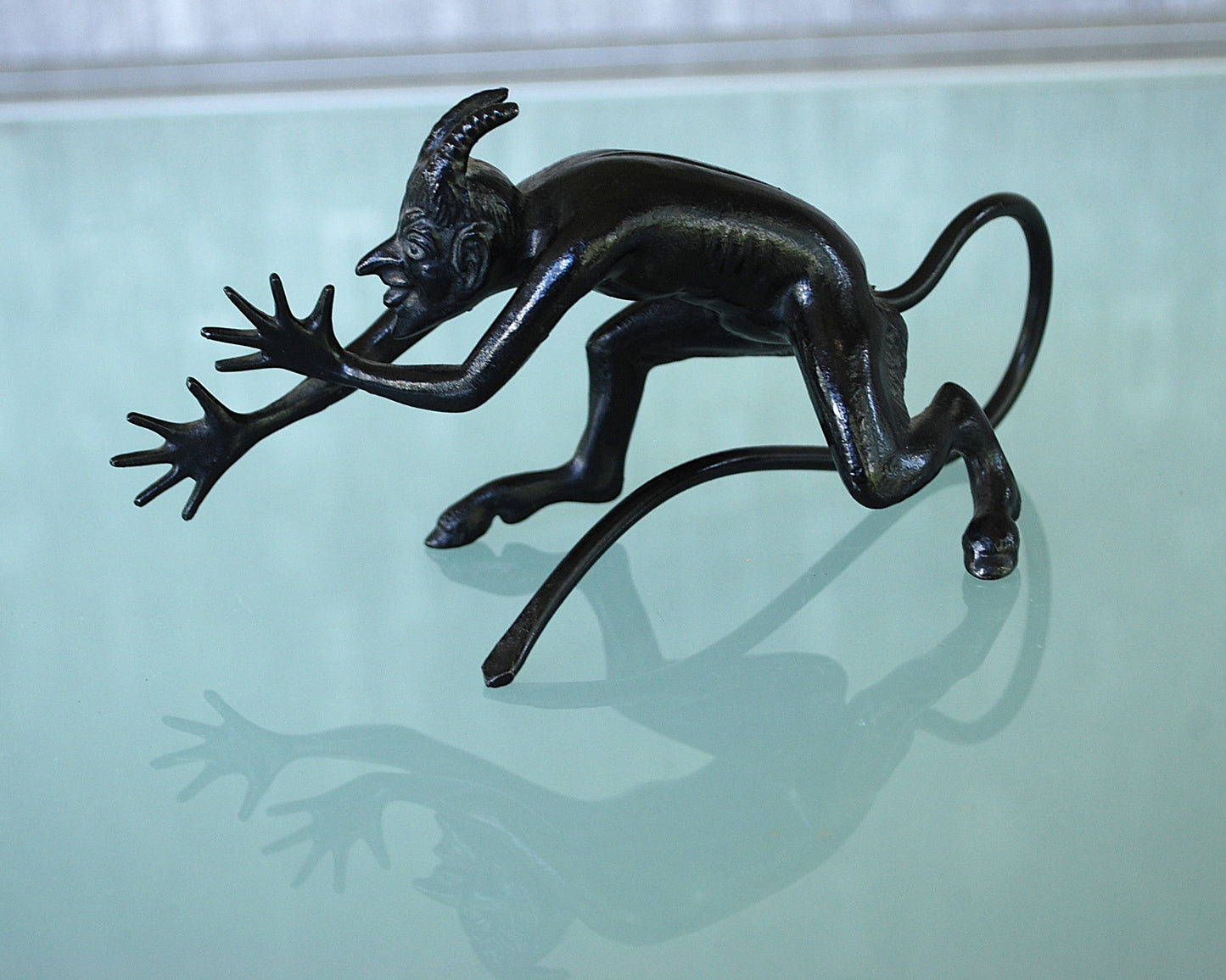 Devil pulls a long nose Kasli iron sculpture CCCP.
