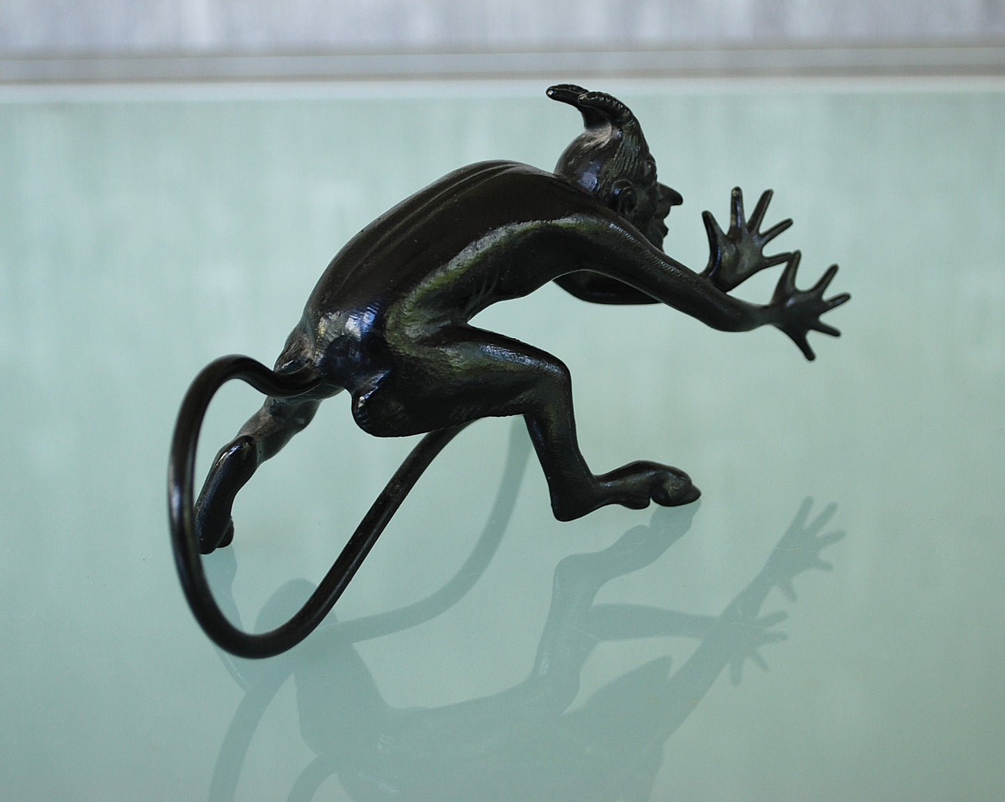 Devil pulls a long nose Kasli iron sculpture CCCP.