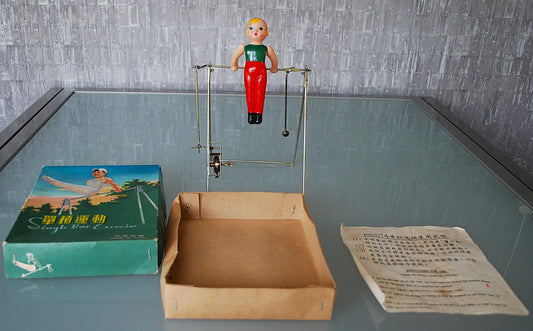 Vintage Opwind baar Turner Trapeze speelgoed in doos