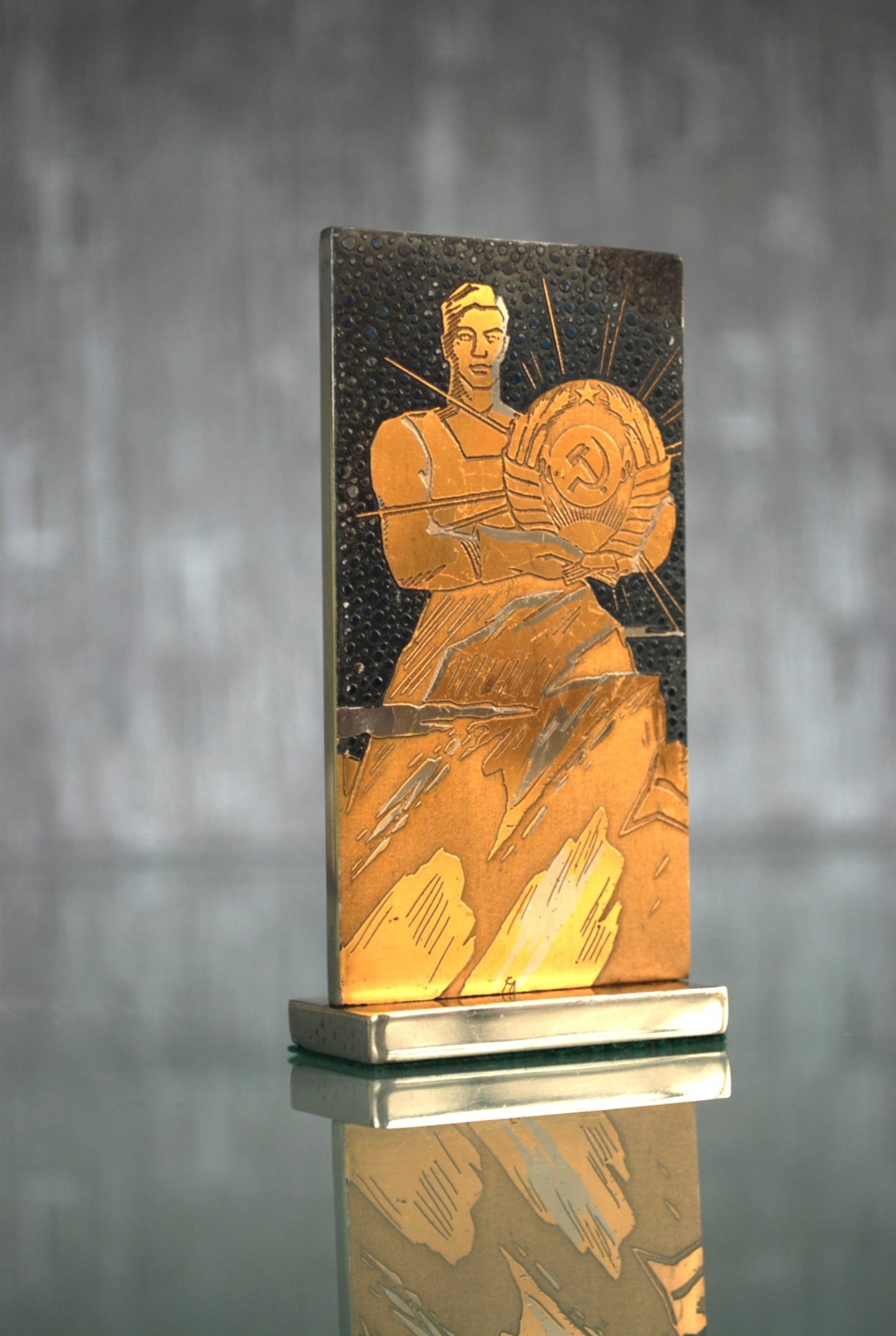 CCCP coat of arms in the hands of a worker *