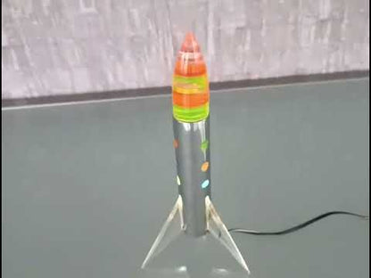 Raket lamp staand op 3 vleugels met gekleurde schijven punt. *